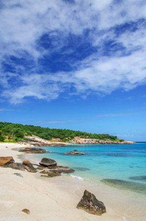 Picturesque tropical golden sandy Sunset Beach with turquoise water on Lizard Island, Australia. Lizard Island is located on Great Barrier Reef in north-east part of Queenslandの写真素材