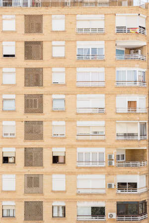 Alicante, Spain; June 30, 2020; General Marva's street is busy with pedestrians, surrounded by palm trees and buildings with a blue sky on a sunny day of summerのeditorial素材