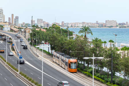 Alicante, Spain; July 08, 2020; landscape of the tram running along the roads, the road full of...