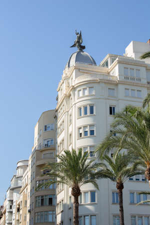 Alicante, Spain; July 15, 2020; building with a sculpture at the top down the street of the rambla...