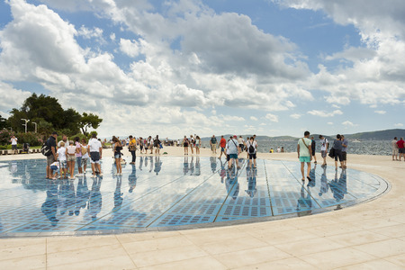 ZADAR, CROATIA - AUGUST 17, 2015: People walking on Greeting to the Sun sculpture. "Greeting to the Sun" by architect Nicola Basic, solar panels in Dalmatian town of Zadarのeditorial素材