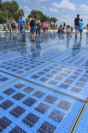 ZADAR, CROATIA - AUGUST 17, 2015: People walking on Greeting to the Sun sculpture. "Greeting to the Sun" by architect Nicola Basic, solar panels in Dalmatian town of Zadarのeditorial素材