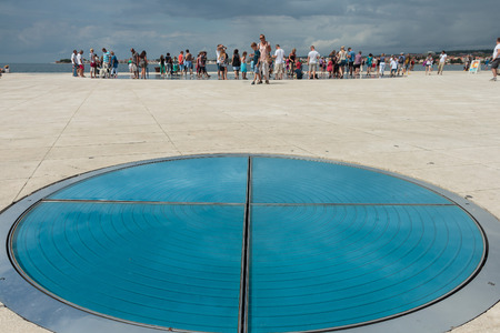 ZADAR, CROATIA - AUGUST 17, 2015: People walking on Greeting to the Sun sculpture. "Greeting to the Sun" by architect Nicola Basic, solar panels in Dalmatian town of Zadarのeditorial素材