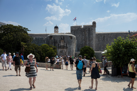 DUBROVNIK, CROATIA - AUGUST 13, 2015: The main entrance "Gates of Pile"  in old part of city of Dubrovnik, Croatia and tourist in front of entranceのeditorial素材