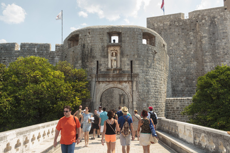 DUBROVNIK, CROATIA - AUGUST 13, 2015: The main entrance "Gates of Pile"  in old part of city of Dubrovnik, Croatia and tourist in front of entranceのeditorial素材