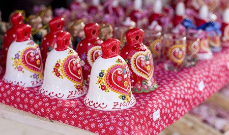 ZAGREB, CROATIA - DECEMBER 13, 2014: Advent in Zagreb, Croatia. A vendor selling hand made Christmas decorations with traditional Licitar heart simbol of Zagrebのeditorial素材