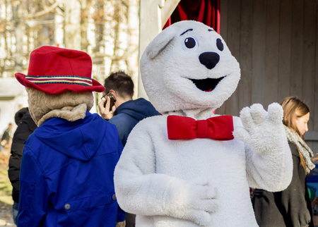 ZAGREB, CROATIA - DECEMBER 13, 2014: Advent in Zagreb, Croatia. Man in bear costume entertaining visitors of Advent in Zagrebのeditorial素材