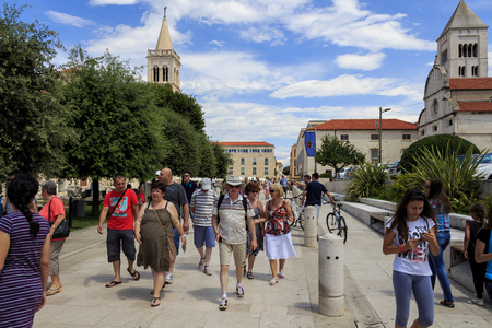 ZADAR, CROATIA - JULY 15, 2014: Street view with st. Donatus church in background. Zadar is seat of Roman Catholic Archdiocese of Zadar and historical center of Dalmatia.のeditorial素材