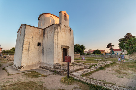 NIN, CROATIA - JULY 07, 2016: The smallest cathedral in the world, church of the Holy cross, built in the 9th century in Nin, Croatia.のeditorial素材