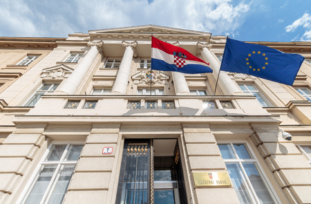 ZAGREB, CROATIA - MAY 07, 2016: Croatian and European flag's blowing in the wind on the Croatian parliament buildingのeditorial素材