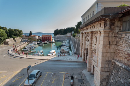 ZADAR, CROATIA - JULY 10, 2016: Fosa small harbor in Zadar and remains of the past: walls, towers, imposing gates. Among the towers is Captain and the Land Gate, a masterpiece of the late Renaissance.のeditorial素材