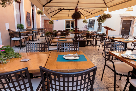 ZADAR, CROATIA - JULY 10, 2016: One of Zadar restaurants ready for hungry customersのeditorial素材
