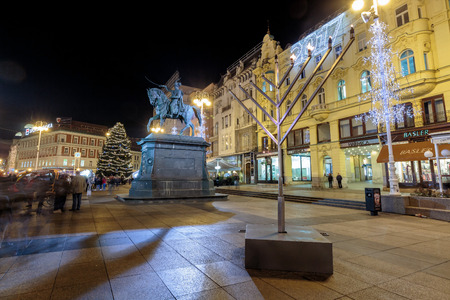 ZAGREB, CROATIA - DECEMBER 27, 2016: Advent in Zagreb, Menorah and Christmas tree on main square of Ban Jelacic in Zagreb, croatiaのeditorial素材