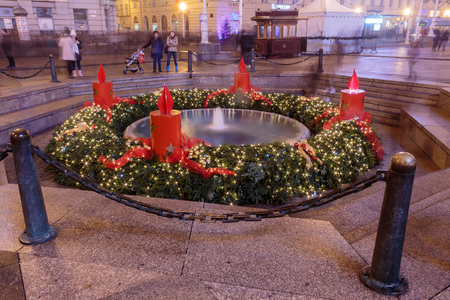 ZAGREB, CROATIA - DECEMBER 5, 2015: Advent in Zagreb, Night photo of Mandusevac fountain decorated with advent wreath. Ban Josip Jelacic square in Zagreb, Croatia.のeditorial素材