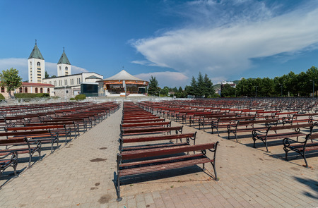 MEDUGORJE, BOSNIA AND HERZEGOVINA - JULY 12, 2016: Benches and altar behind the parish church of St. James, the shrine of Our Lady of Medugorjeのeditorial素材