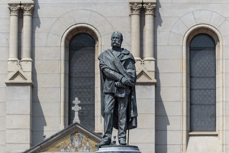 Sculpture of the Petar Preradovic a Croatian poet, writer, and military general in the Austro Hungarian Army. Serbian orthodox church in backgroundのeditorial素材