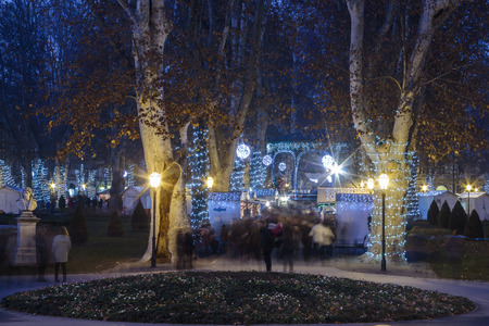 ZAGREB, CROATIA - DECEMBER 27, 2015: Advent in Zagreb, Christmas stands in the park Zrinjevac in Zagreb, Croatia, night photo blue hourのeditorial素材