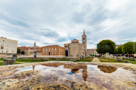 ZADAR, CROATIA - JULY 15, 2016: Church of St. Donatus, Zadar, a monumental building from the 9th century in Zadar, Croatia, reflection in waterのeditorial素材
