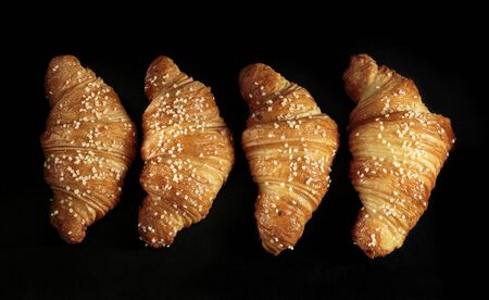 Croissant sprinkled with white chocolateの写真素材