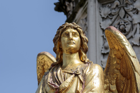 Golden angel sculptureの写真素材