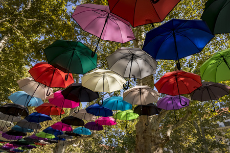 Colorful umbrellas in the skyの写真素材