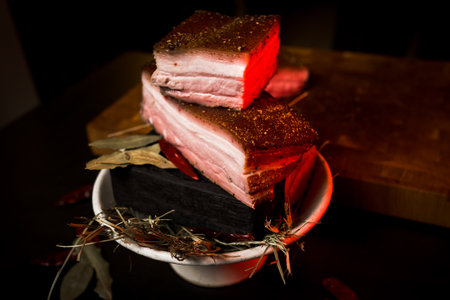 Raw meat with spices on a black background. Selective focus.の写真素材