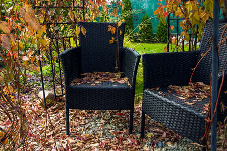 Two black chairs in a garden gazeboの写真素材