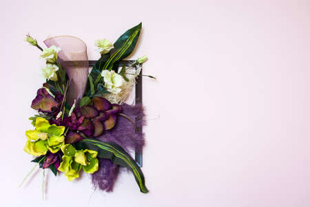 Artificial flower bouquet in a frameの写真素材