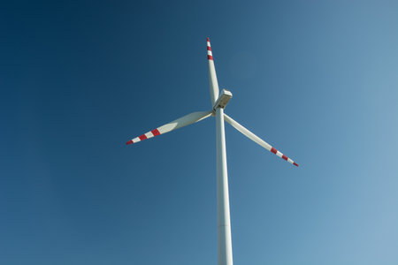 Lesniowice, Lubelskie, Poland - August 30, 2017: A single energy windmill against the sky