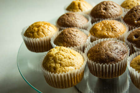 Homemade brown shortcake on a cake standの写真素材