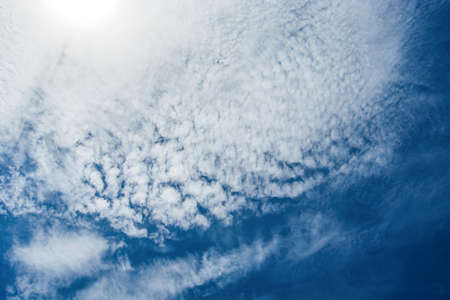 White fluffy clouds in the blue sky