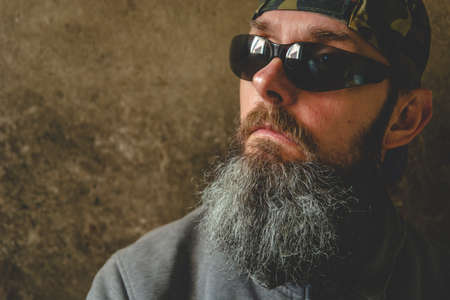 A man with a long beard wearing sunglasses, portraitの写真素材