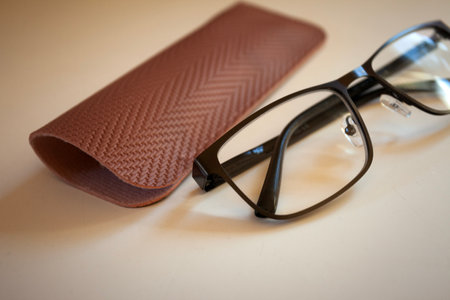 The glasses and case lie on the white counter