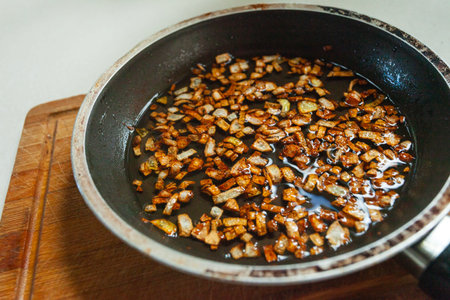 Fried onion with vegetable oil in a panの写真素材