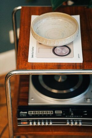 Luguxy and vintage shelf with bowl, a gramophone and magazineの写真素材
