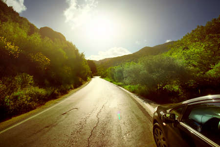 Car ride on road in sunny weatherの写真素材