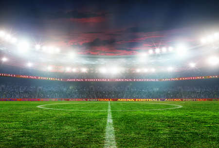 Soccer ball on the field of stadium with lightの写真素材