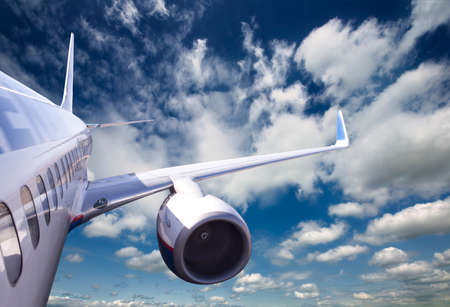 Large passenger plane flying in the blue sky