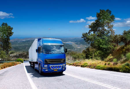 truck carrying loads on a mountain roadの写真素材