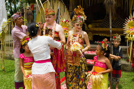 BALI, INDONESIA - NOV 24: Traditional wedding ceremony on November 24, 2010 in Bali, Indonesia. The ceremony takes place in old royal palace and all villagers participate in the ceremonyのeditorial素材