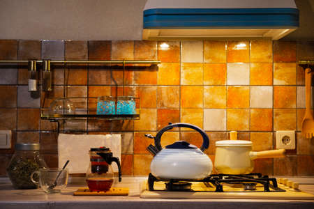 Modern kitchen in the evening on which gotovyata romatny, hot tea.の写真素材