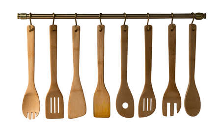 Wooden spoons, spatulas and a rolling pin isolated on white background
