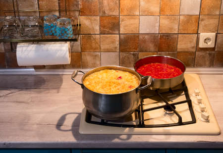 in the kitchen preparing dinner. Soup and fried cabbage