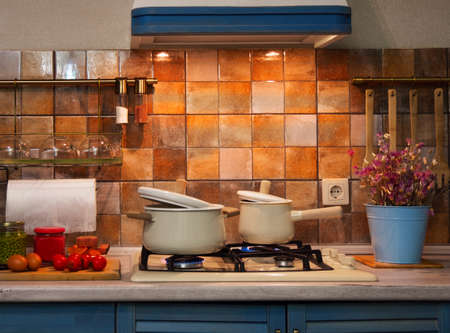 modern, new kitchen. Processes for preparing dinner on the stove in a saucepan.の写真素材