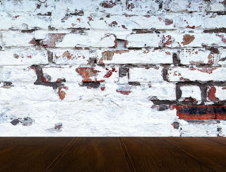 Empty beige wood table top with glossy ceramic white tile wall,Mock up for display or montage of...