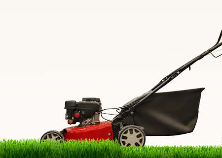 Lawn mower mows lawn. Is isolated. on a white backgroundの写真素材
