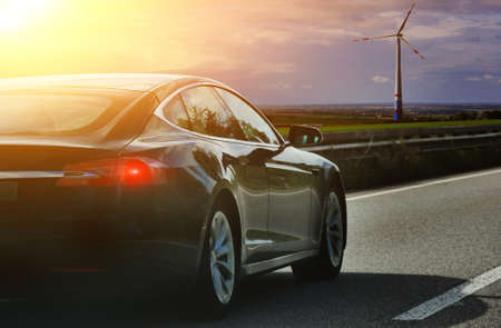 Â  car on autobahn at sunsetの写真素材