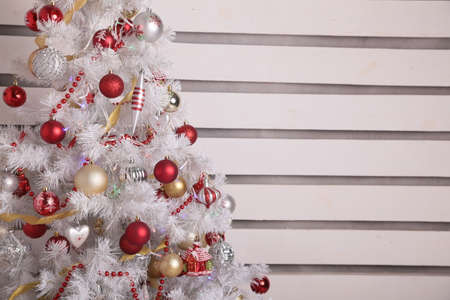 holiday photo of cozy home interior, with Christmas tree and New Year decorationの写真素材