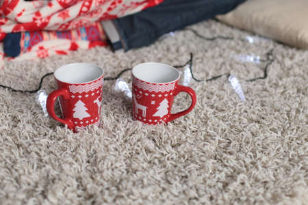 holiday photo, Christmas details. cup with Christmas ornamentの写真素材