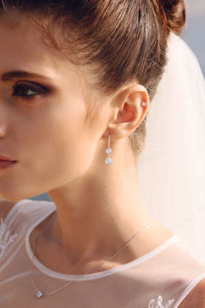 beautiful portrait of gorgeous bride posing at seacoastの写真素材